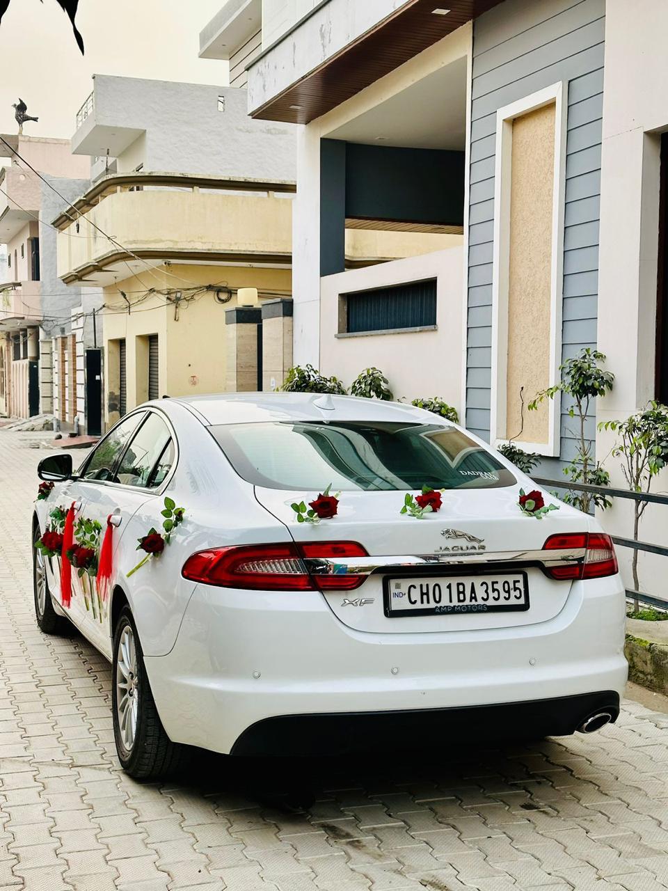 Jaguar XF decorated as a wedding fleet vehicle.